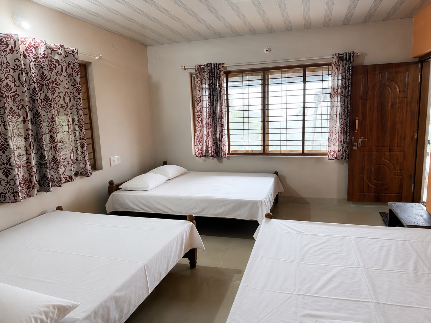 Three-bed room with large window looking out to the estate